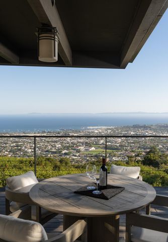 a view of a balcony with an ocean