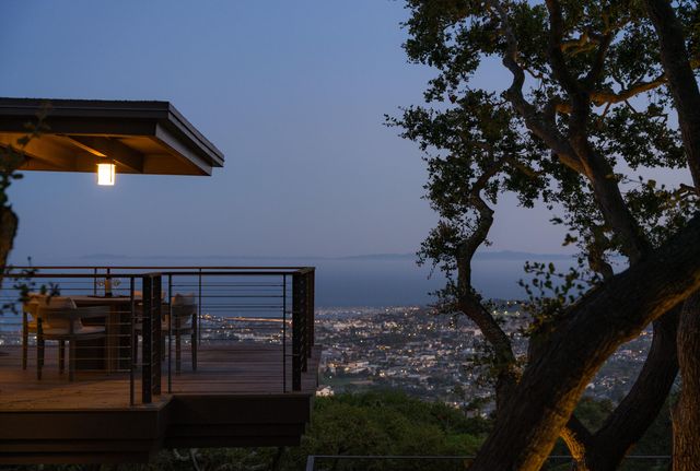 a aerial view of a house with swimming pool and furniture