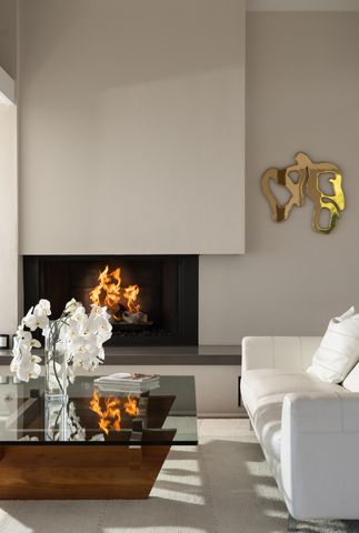 a living room with furniture and flowers