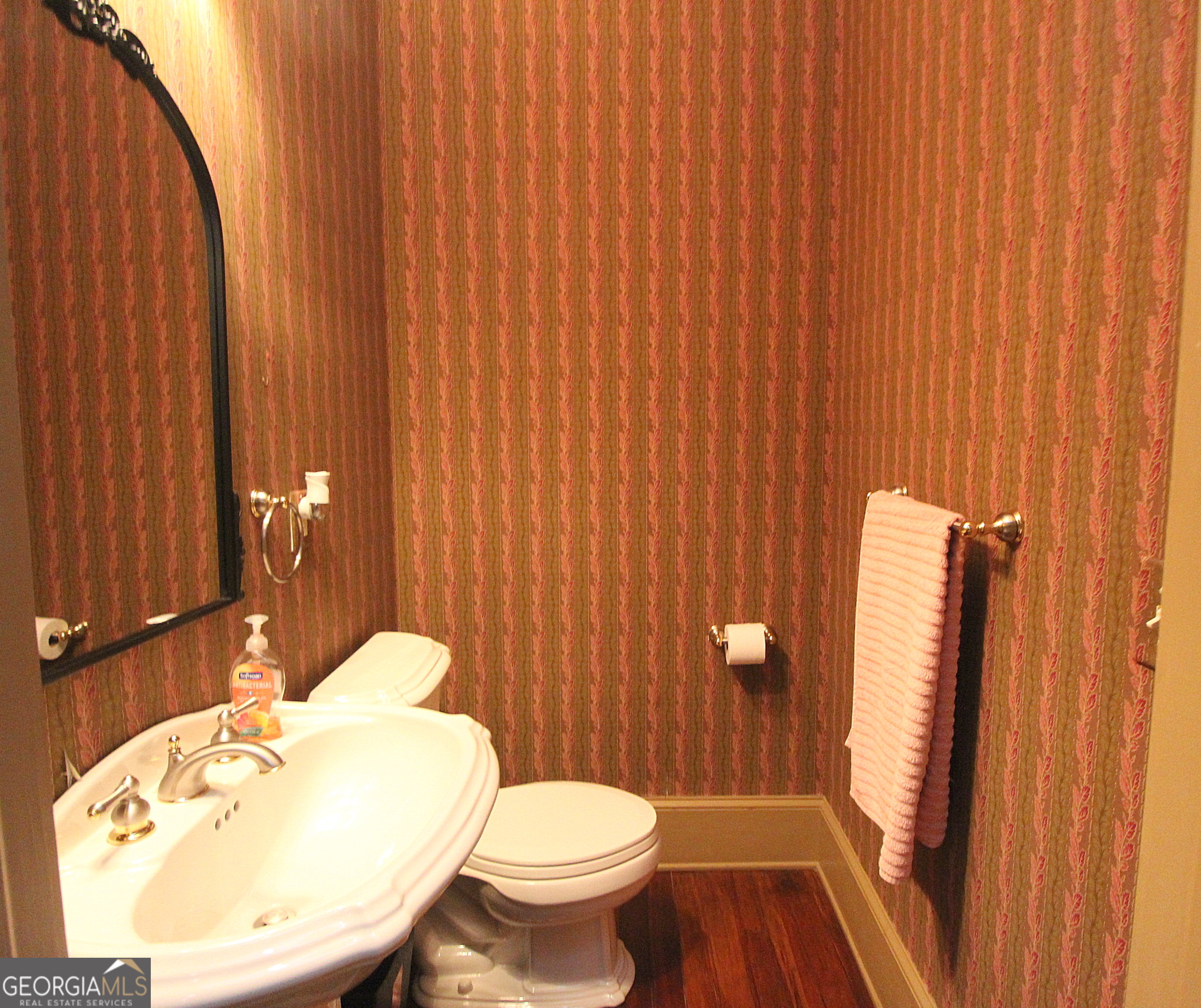 320 East 3rd Avenue Rome, GA 30161 - Photo 114 of 152 a bathroom with a sink a toilet and shower curtain