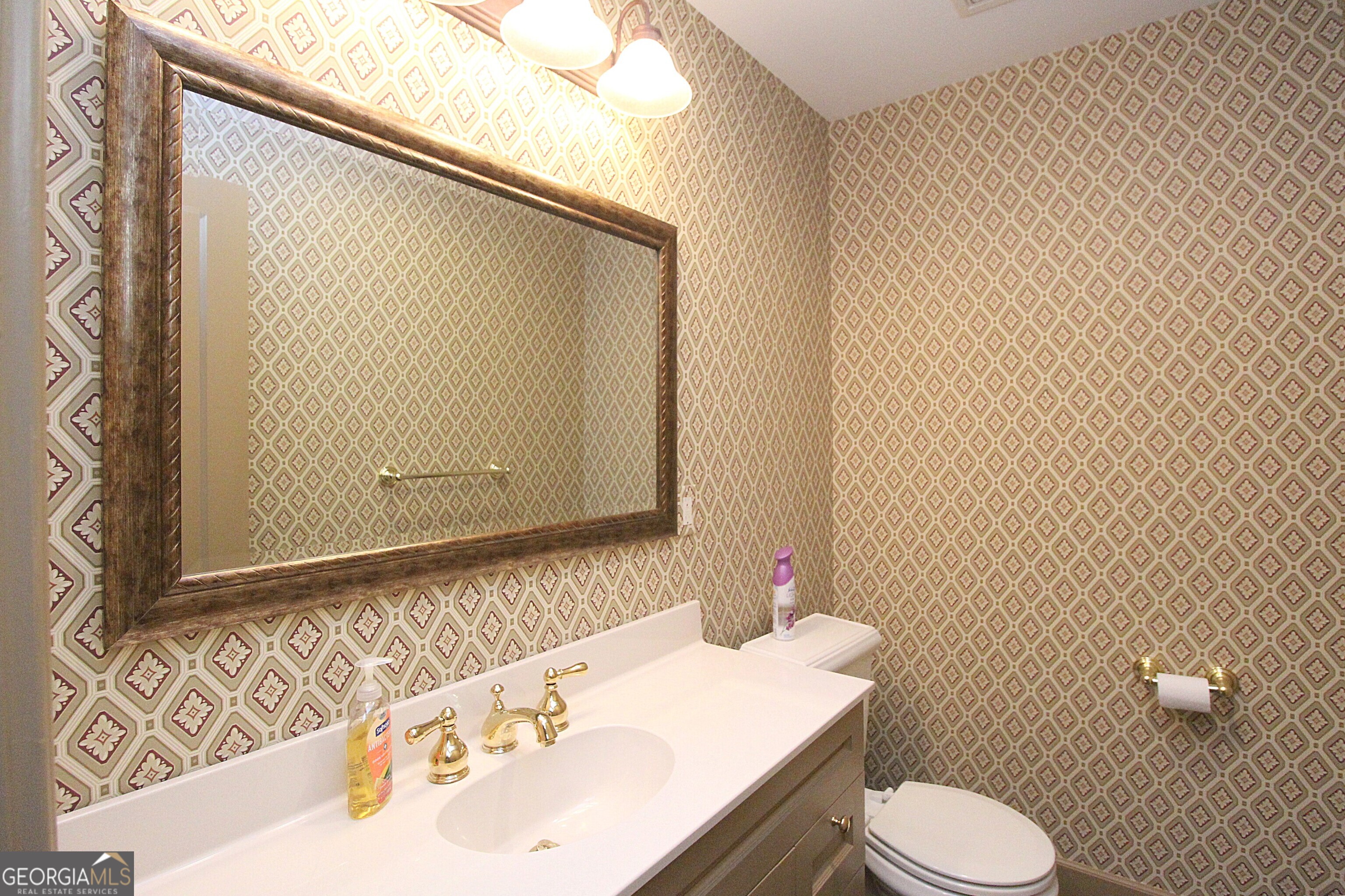 320 East 3rd Avenue Rome, GA 30161 - Photo 120 of 152 a bathroom with a sink a toilet and mirror