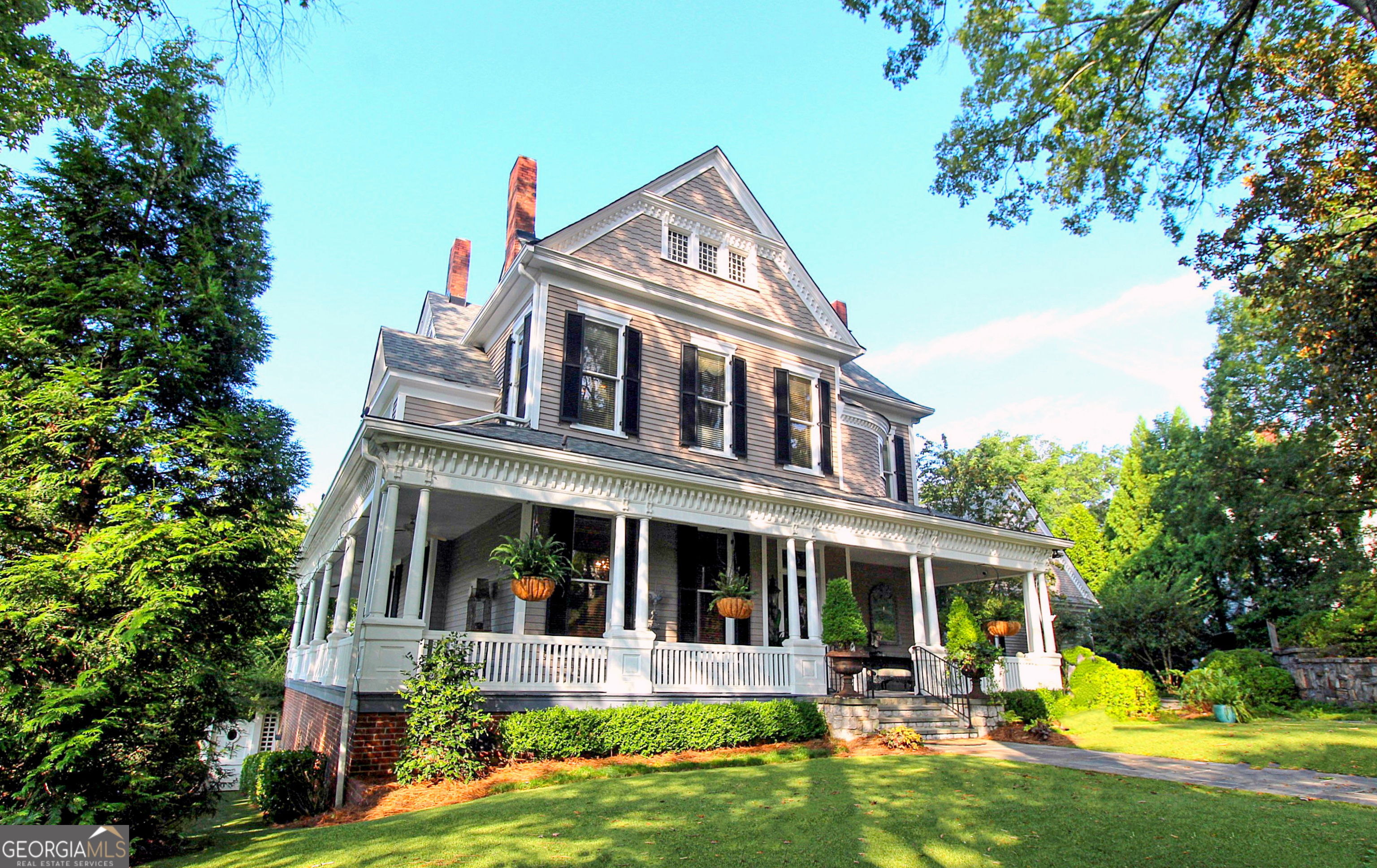 320 East 3rd Avenue Rome, GA 30161 - Photo 2 of 152 a front view of a house with swimming pool and porch with furniture