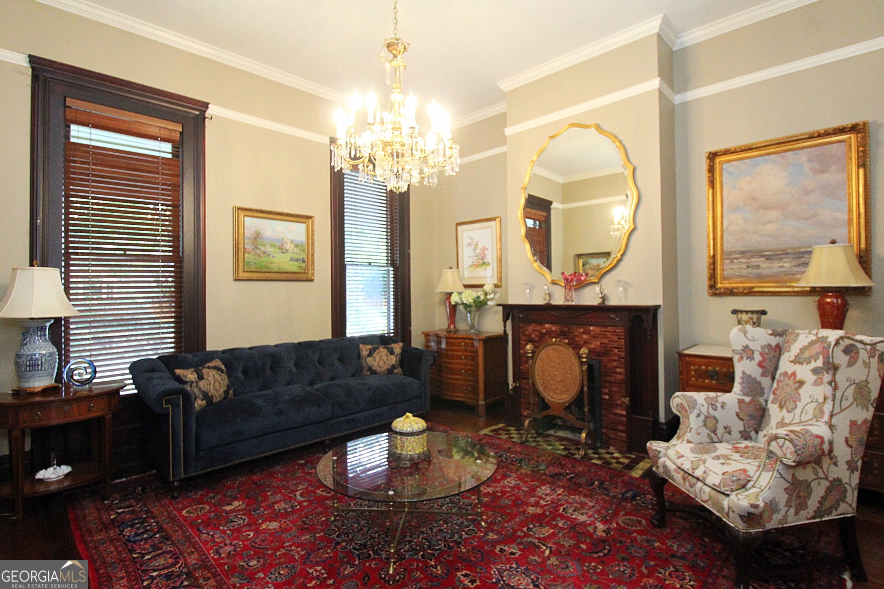 320 East 3rd Avenue Rome, GA 30161 - Photo 28 of 152 a living room with furniture a fireplace and a chandelier