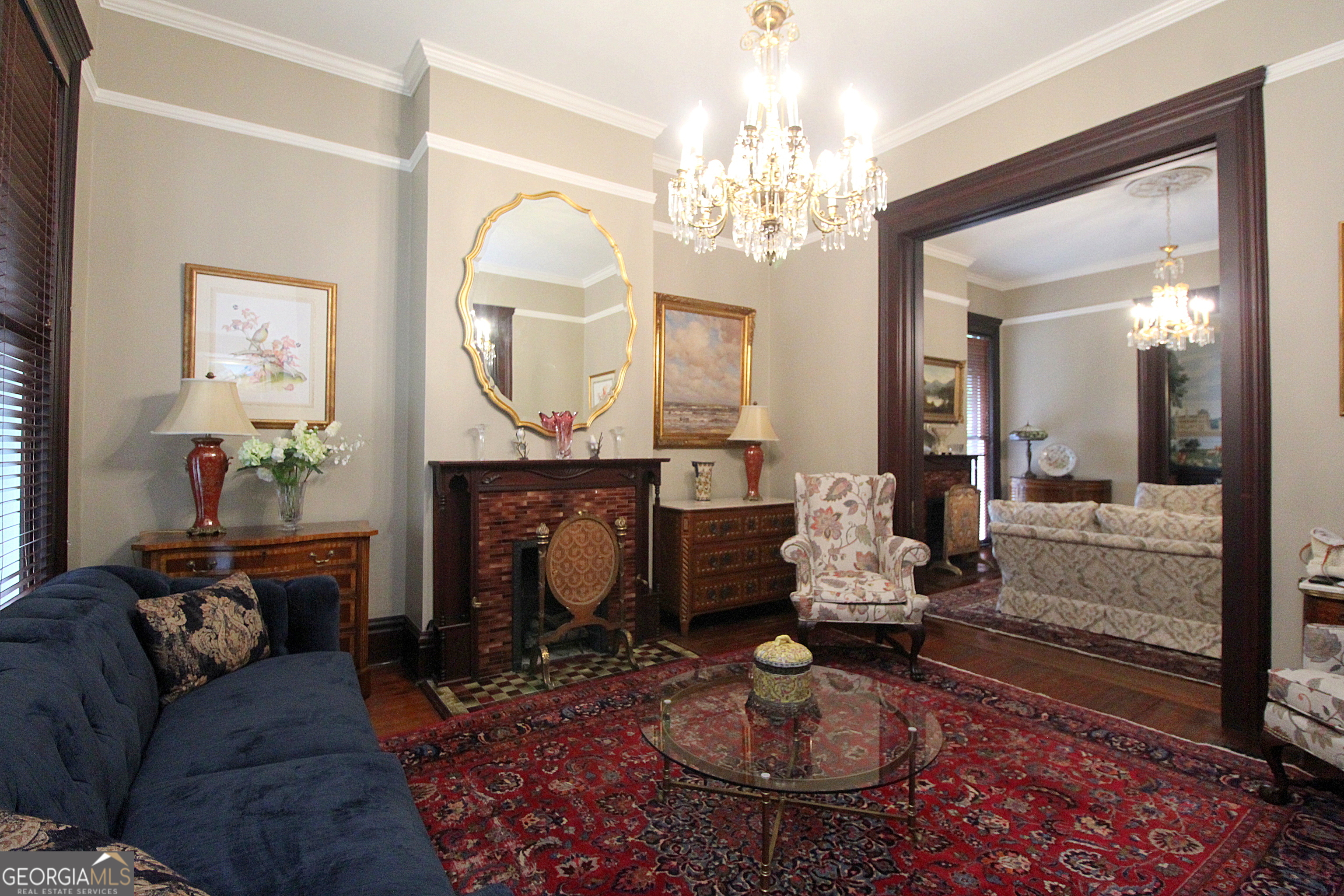 320 East 3rd Avenue Rome, GA 30161 - Photo 30 of 152 a living room with furniture a fireplace and a chandelier