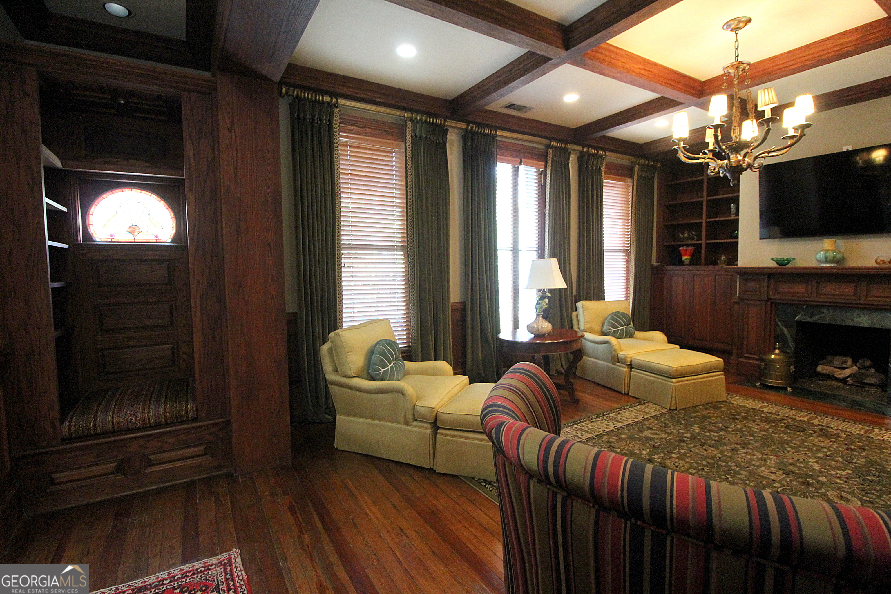 320 East 3rd Avenue Rome, GA 30161 - Photo 51 of 152 a bedroom with furniture a flat screen tv and a fireplace