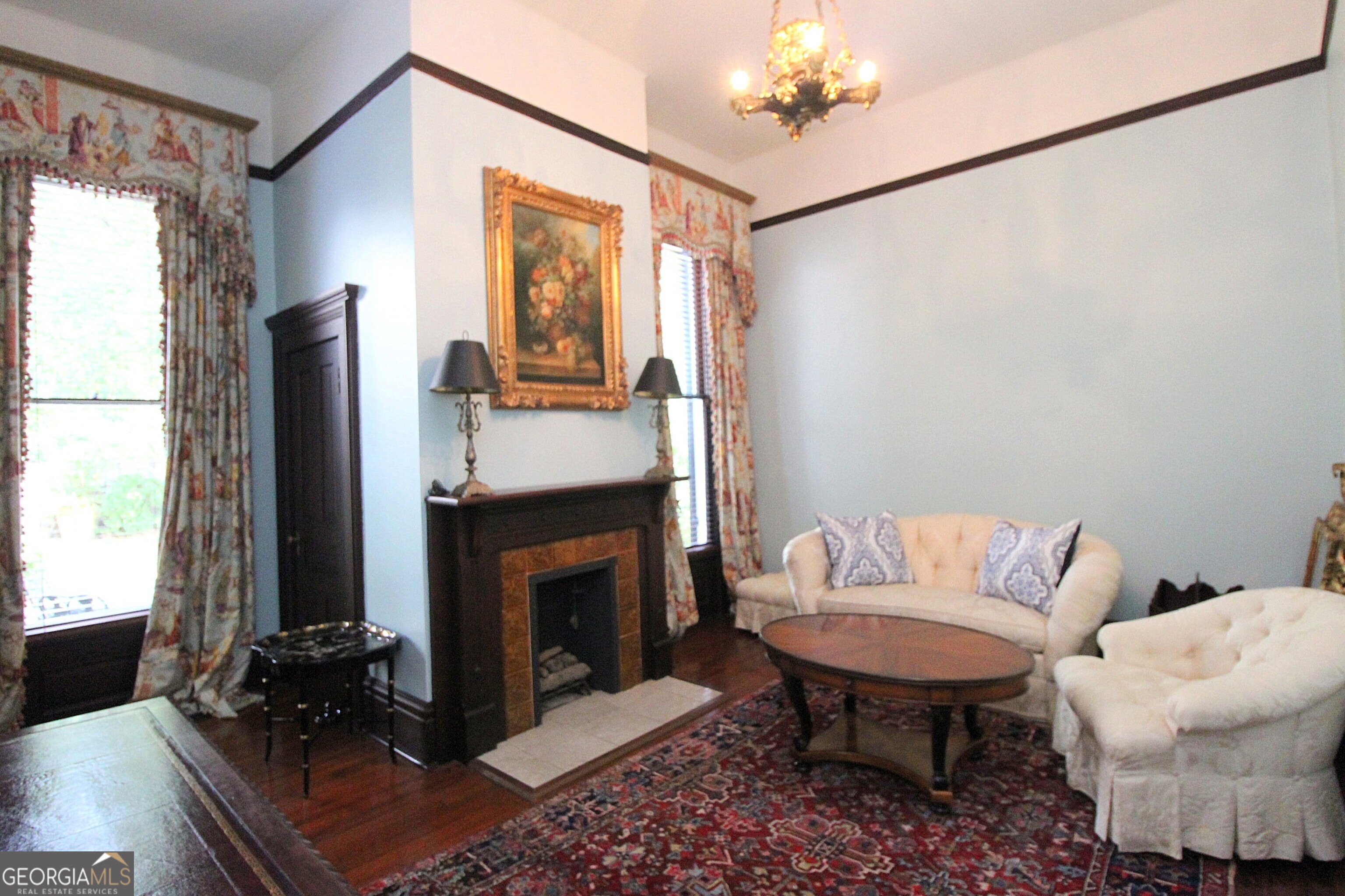 320 East 3rd Avenue Rome, GA 30161 - Photo 62 of 152 a living room with furniture a fireplace and a flat screen tv