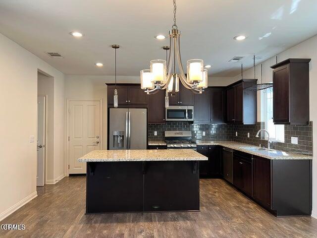 668 Owens River Drive Oxnard, CA 93036 - Photo 2 of 10 a large kitchen with a counter space a sink appliances and cabinets