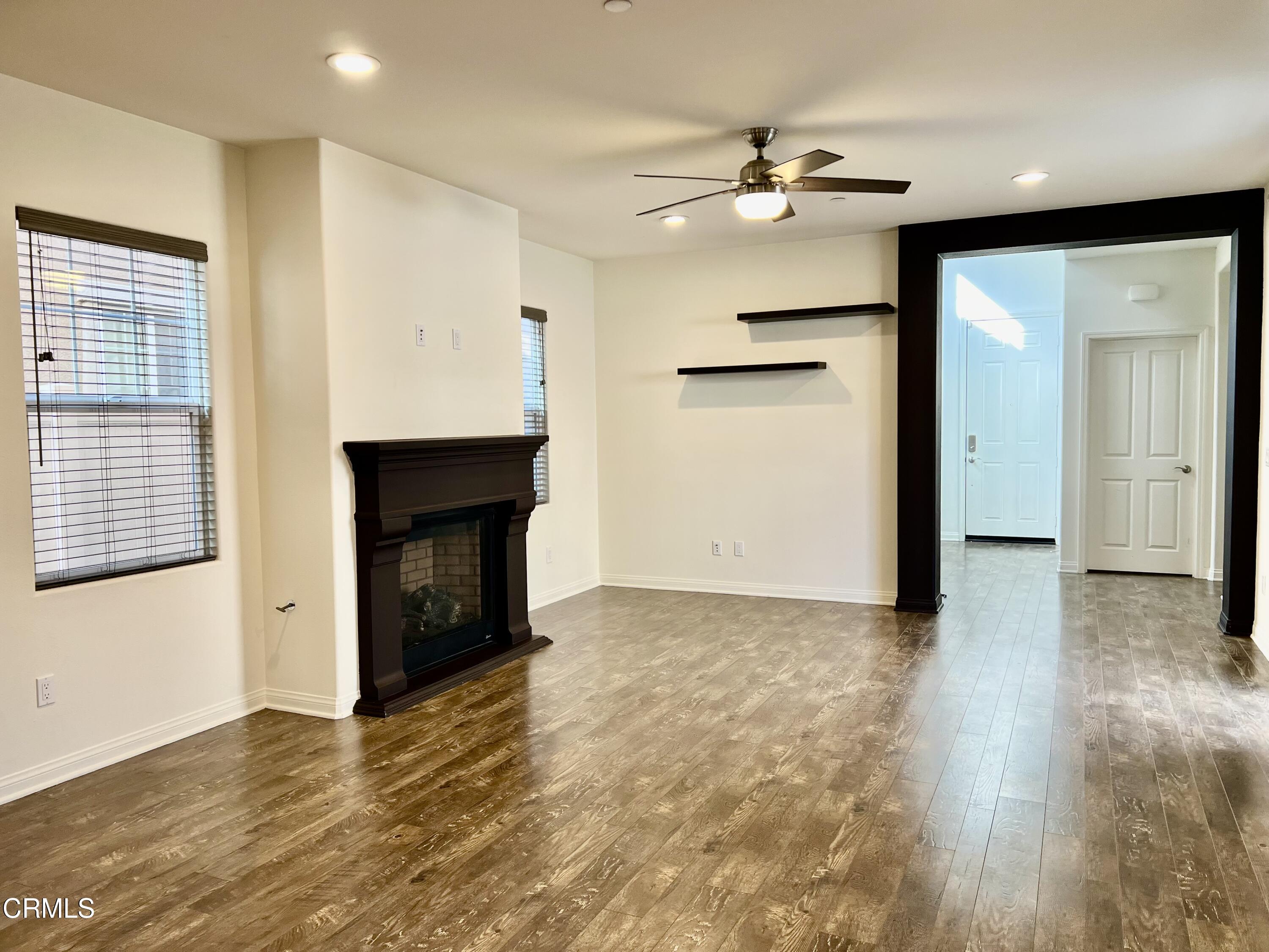 668 Owens River Drive Oxnard, CA 93036 - Photo 3 of 10 wooden floor in an empty room with a fireplace