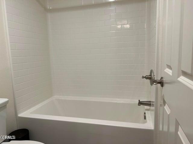 668 Owens River Drive Oxnard, CA 93036 - Photo 7 of 10 a close up of a bathtub in a bathroom