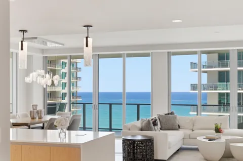 a view of a balcony with table and chairs