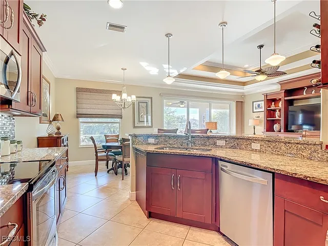 a kitchen with lots of counter top space and dining table
