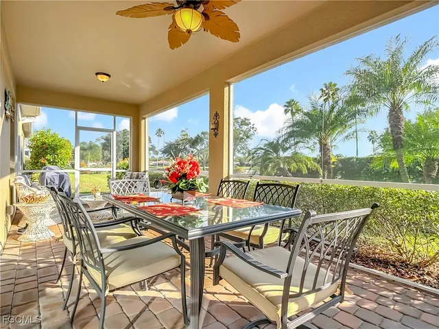 a view of an outdoor dining space with furniture and garden view