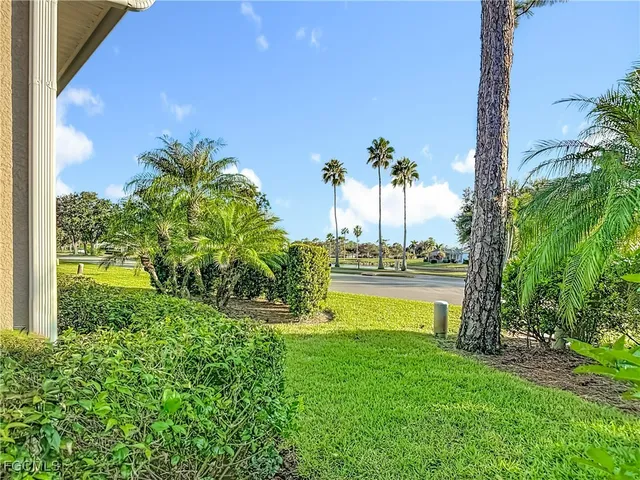 a view of a swimming pool with a yard