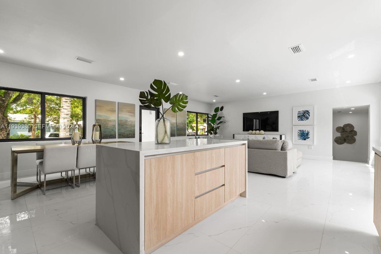 1741 Southwest 17th Court Miami, FL 33145 - Photo 11 of 19 a kitchen with white cabinets and couches