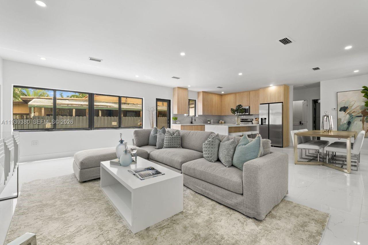 1741 Southwest 17th Court Miami, FL 33145 - Photo 5 of 19 a living room with furniture and a large window