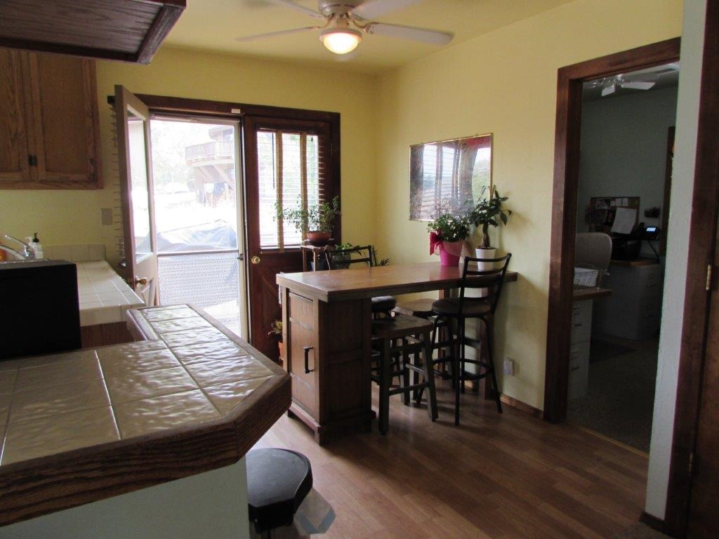 154 South Landing Road Crowley Lake, CA 93546 - Photo 11 of 27 a view of a dining room with furniture and wooden floor