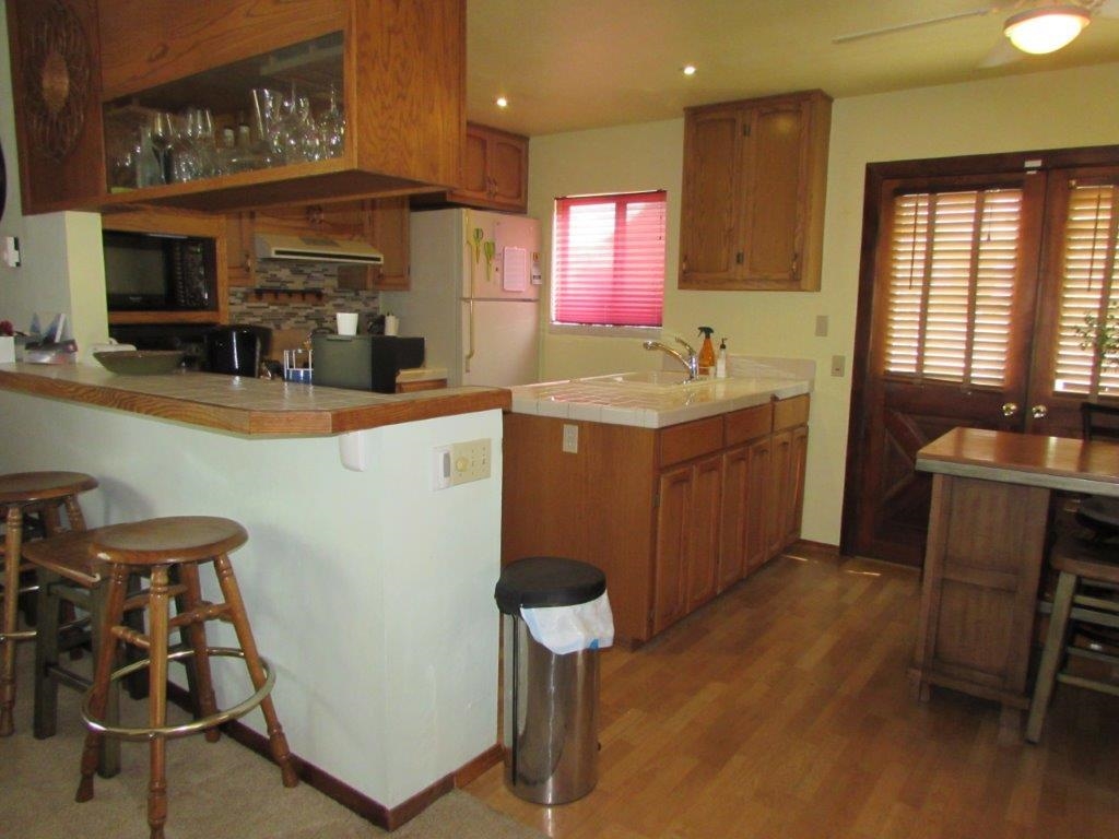 154 South Landing Road Crowley Lake, CA 93546 - Photo 12 of 27 a kitchen with a sink cabinets and window