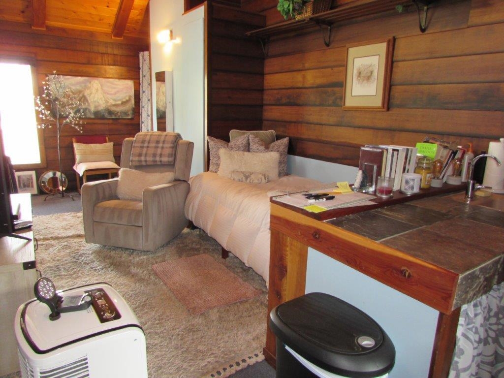 154 South Landing Road Crowley Lake, CA 93546 - Photo 14 of 27 a room with furniture and a floor to ceiling window