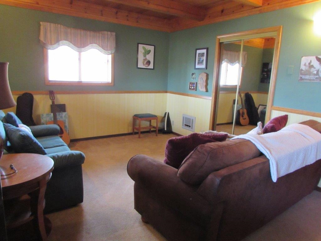 154 South Landing Road Crowley Lake, CA 93546 - Photo 17 of 27 a bedroom with a bed couch and window