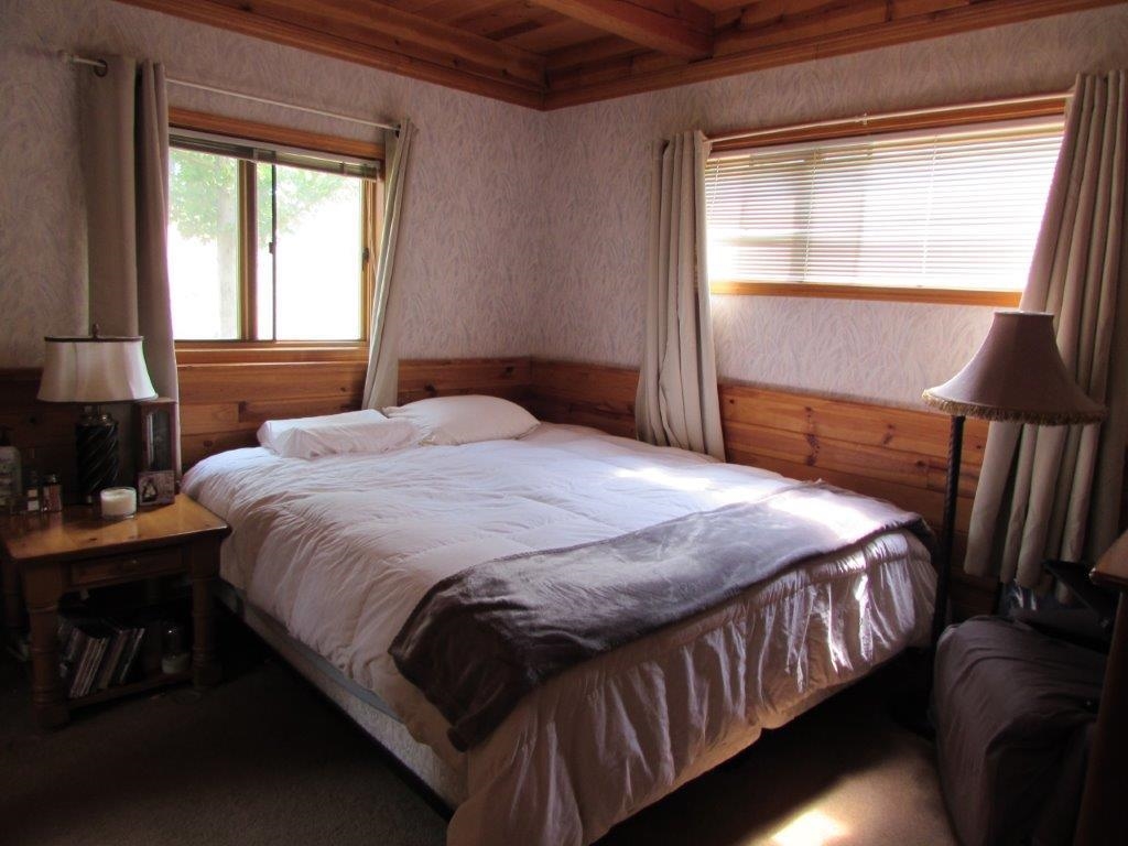 154 South Landing Road Crowley Lake, CA 93546 - Photo 18 of 27 a bedroom with a bed and window