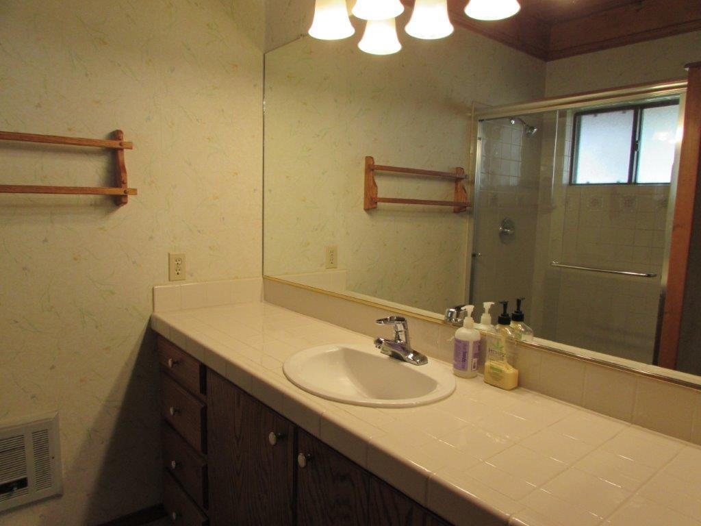 154 South Landing Road Crowley Lake, CA 93546 - Photo 22 of 27 a bathroom with a sink and a mirror
