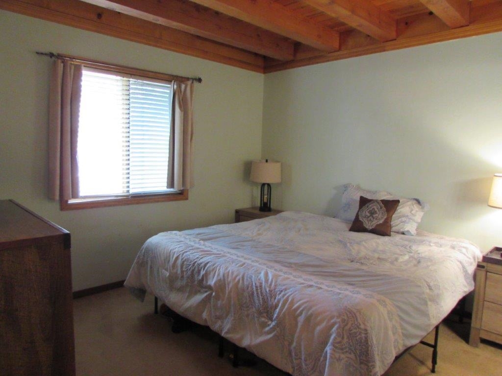 154 South Landing Road Crowley Lake, CA 93546 - Photo 23 of 27 a bedroom with a bed and window