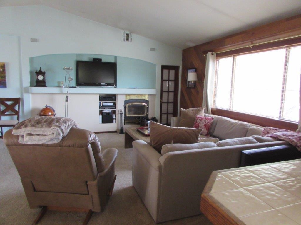 154 South Landing Road Crowley Lake, CA 93546 - Photo 9 of 27 a living room with furniture and a flat screen tv
