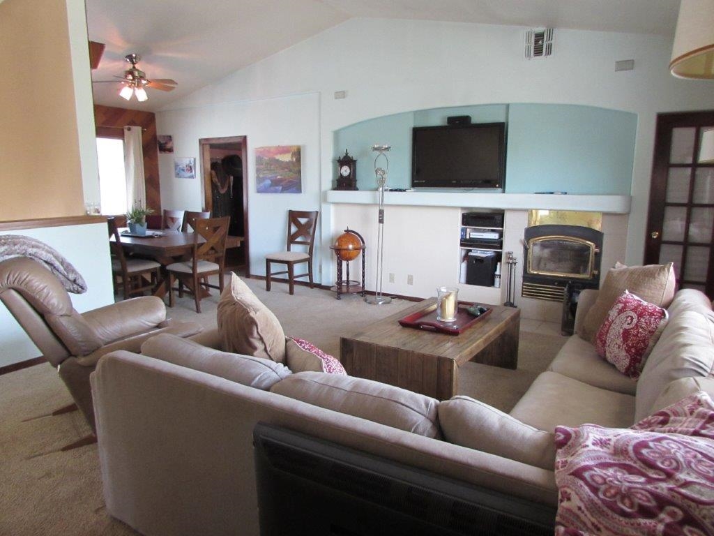 154 South Landing Road Crowley Lake, CA 93546 - Photo 10 of 27 a living room with furniture a flat screen tv and a fireplace