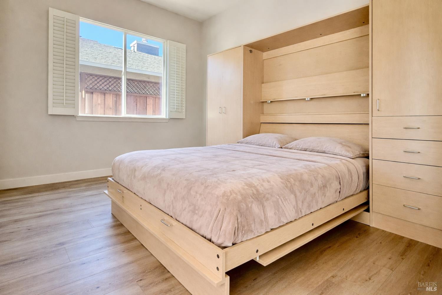 844 Signorelli Circle St. Helena, CA 94574 - Photo 18 of 32 a bed sitting in a bedroom next to a window