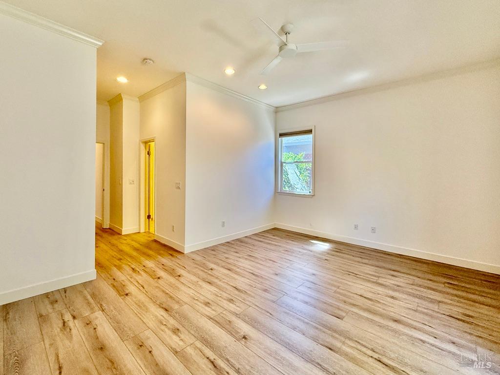 844 Signorelli Circle St. Helena, CA 94574 - Photo 20 of 32 a view of an empty room with wooden floor and a window