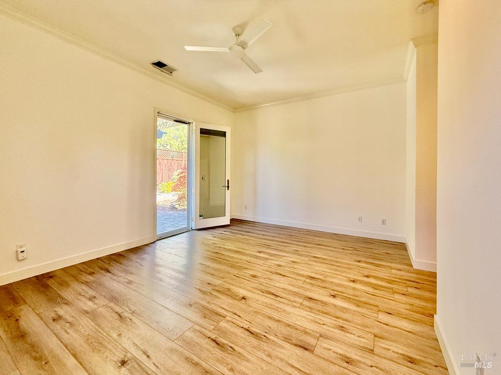 844 Signorelli Circle St. Helena, CA 94574 - Photo 22 of 32 an empty room with wooden floor and windows