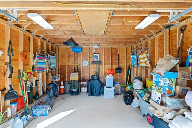 a view of a house with pool and a garden