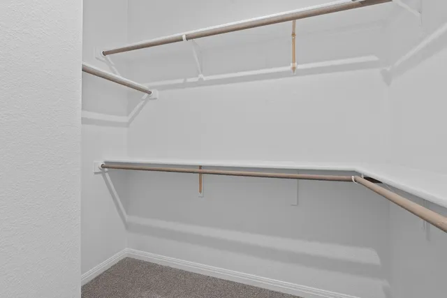 a view of an empty walk in closet