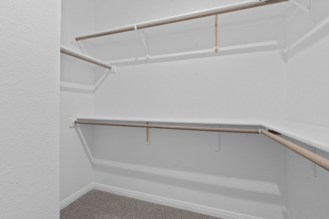 376 Blue Oasis Lane Leander, TX 78641 - Photo 21 of 27 a view of an empty walk in closet