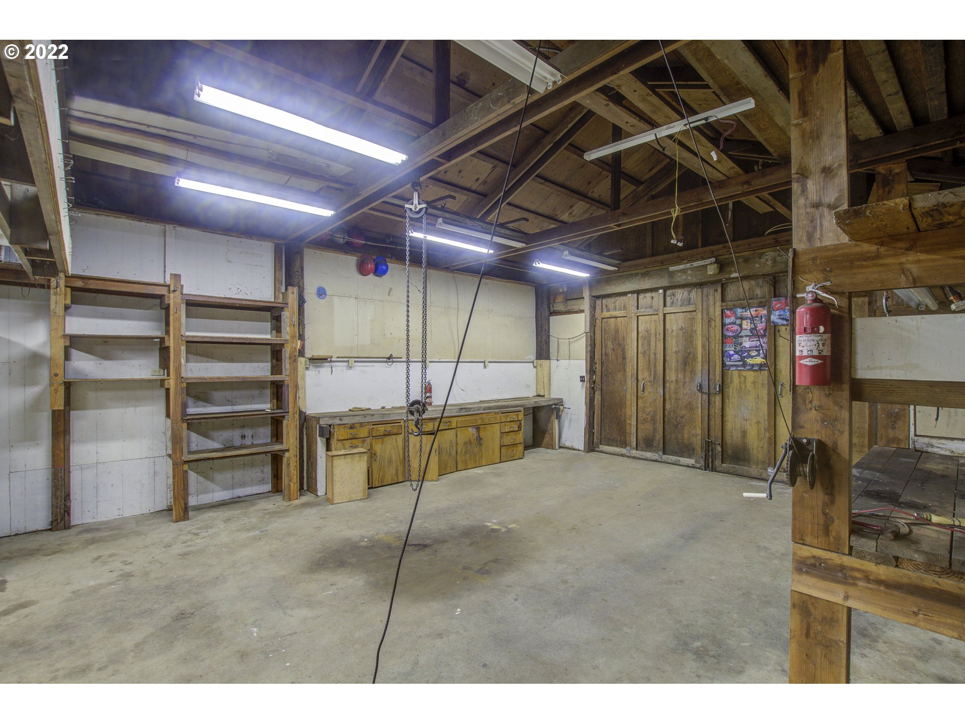 24300 Northwest Maplecrest Road Ridgefield, WA 98642 - Photo 12 of 32 a view of a room with wooden shelves