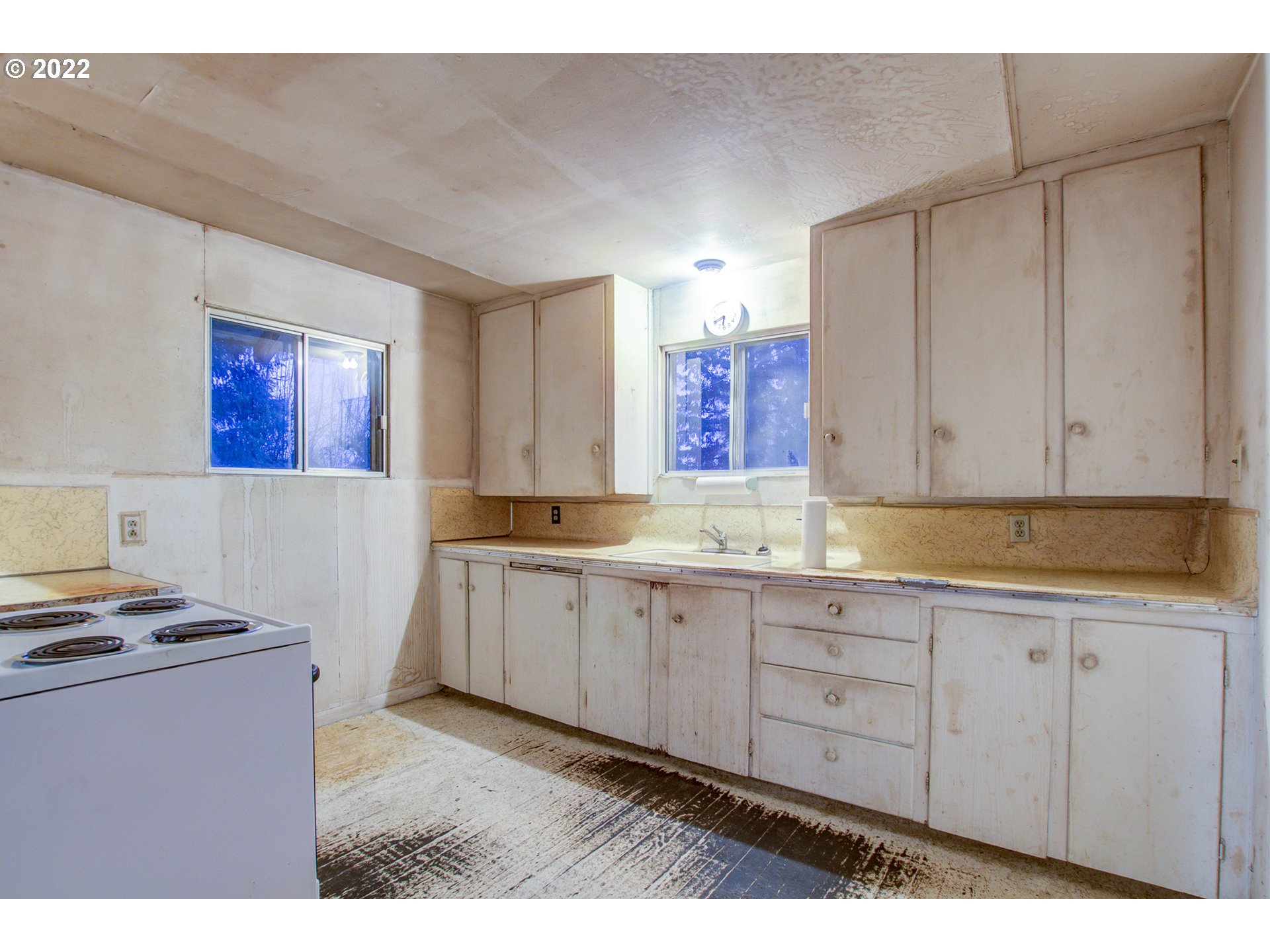 24300 Northwest Maplecrest Road Ridgefield, WA 98642 - Photo 25 of 32 a kitchen with sink cabinets and stove