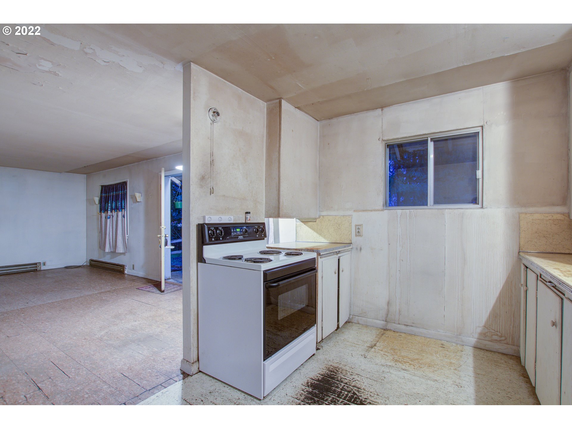 24300 Northwest Maplecrest Road Ridgefield, WA 98642 - Photo 32 of 32 a kitchen with a stove and a microwave