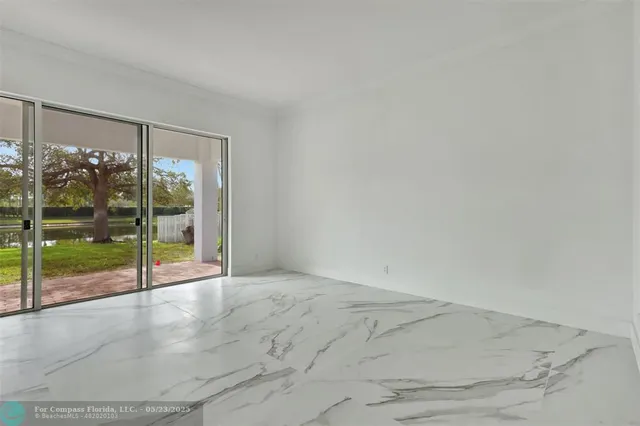 a spacious bedroom with a large bed and a mirror
