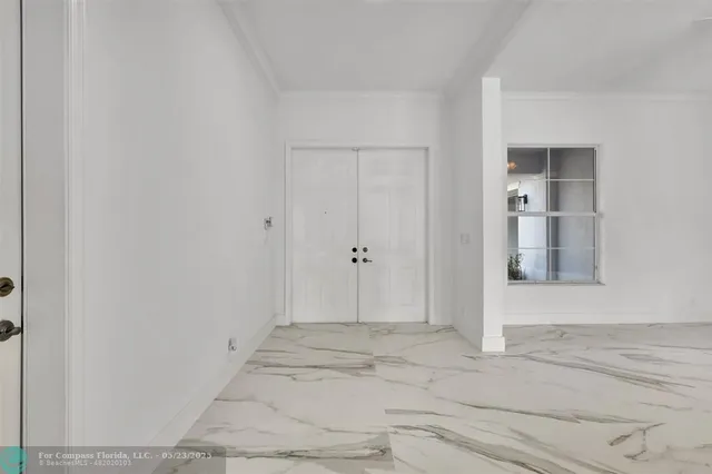 a spacious bathroom with a tub a mirror and vanity
