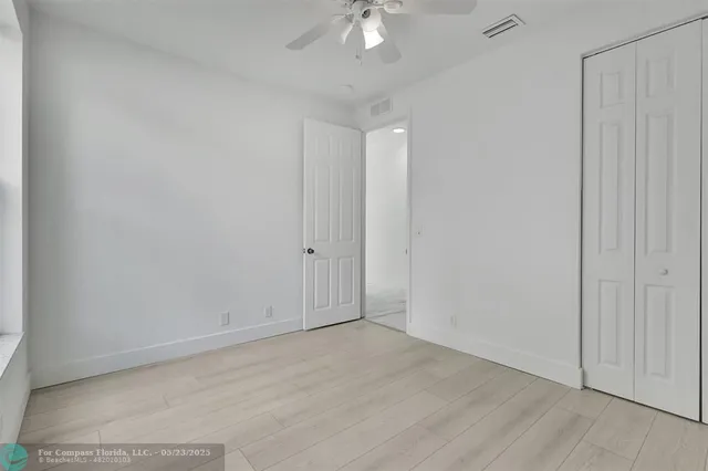 a view of a white house with a outdoor space