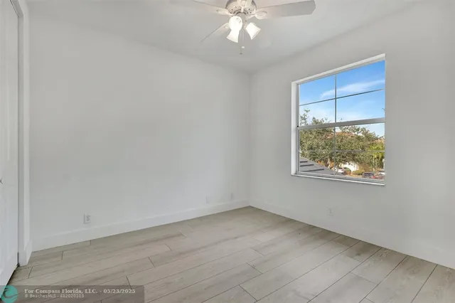 an aerial view of a house with a lake view