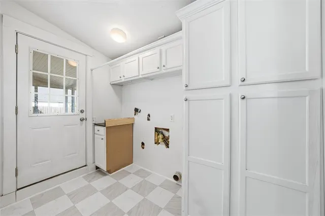 a view of a closet area with an empty room