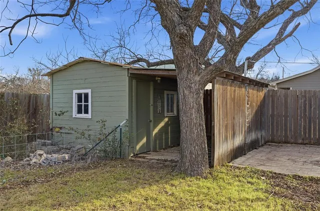 a house with trees in front of it
