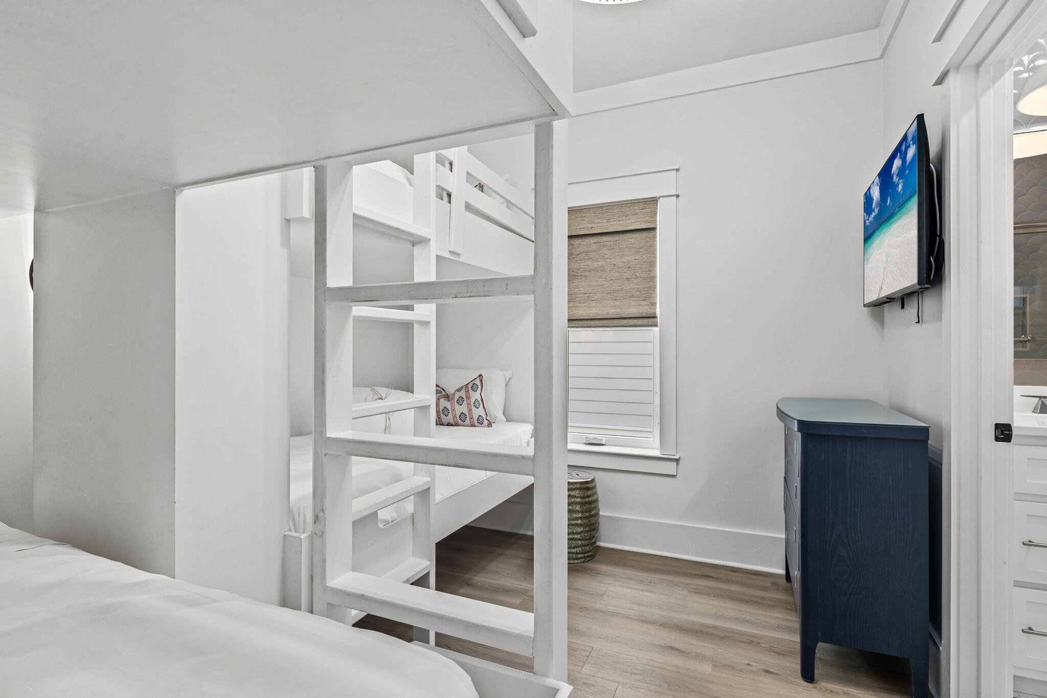 70 Trigger Trail East Inlet Beach, FL 32461 - Photo 34 of 67 a bedroom with a bed and a flat tv screen on the dresser