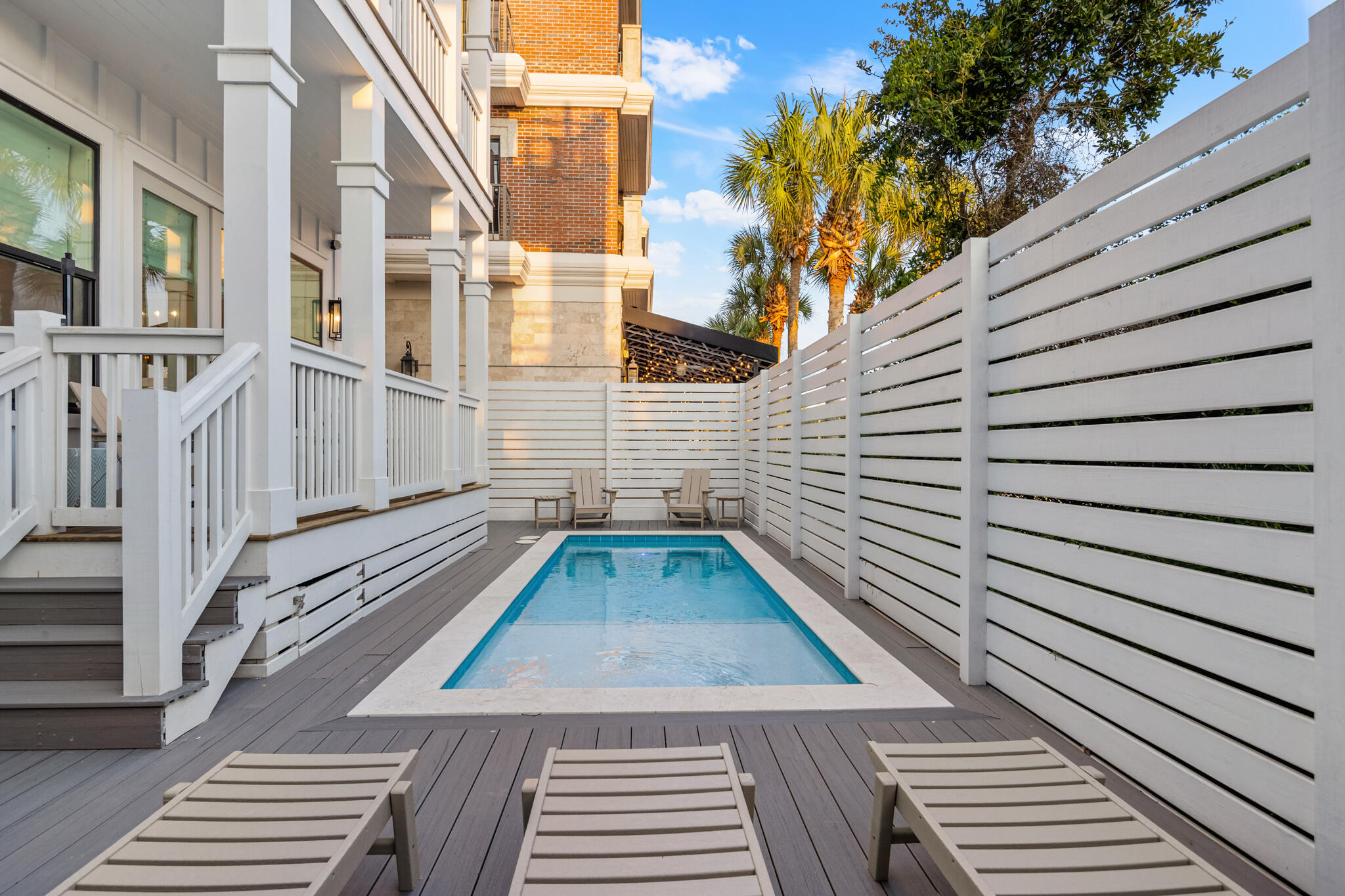 70 Trigger Trail East Inlet Beach, FL 32461 - Photo 61 of 67 a view of a balcony with wooden floor and fence and a floor to ceiling window