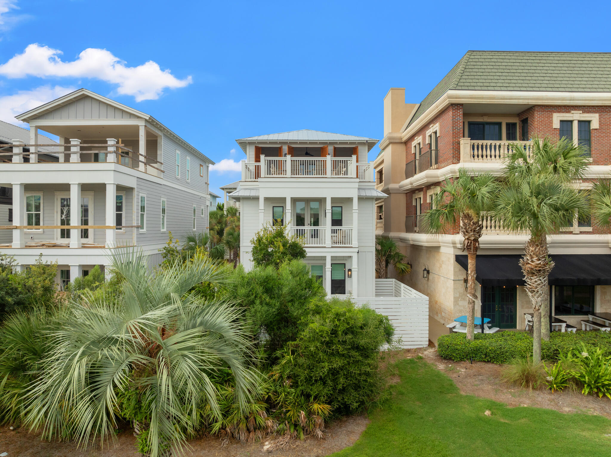 70 Trigger Trail East Inlet Beach, FL 32461 - Photo 66 of 67 a front view of a residential apartment building with a yard