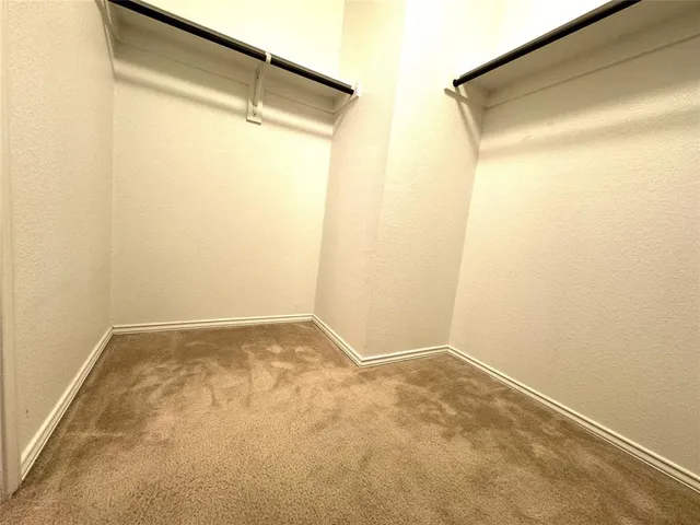 a bathroom with a double vanity sink mirror and toilet