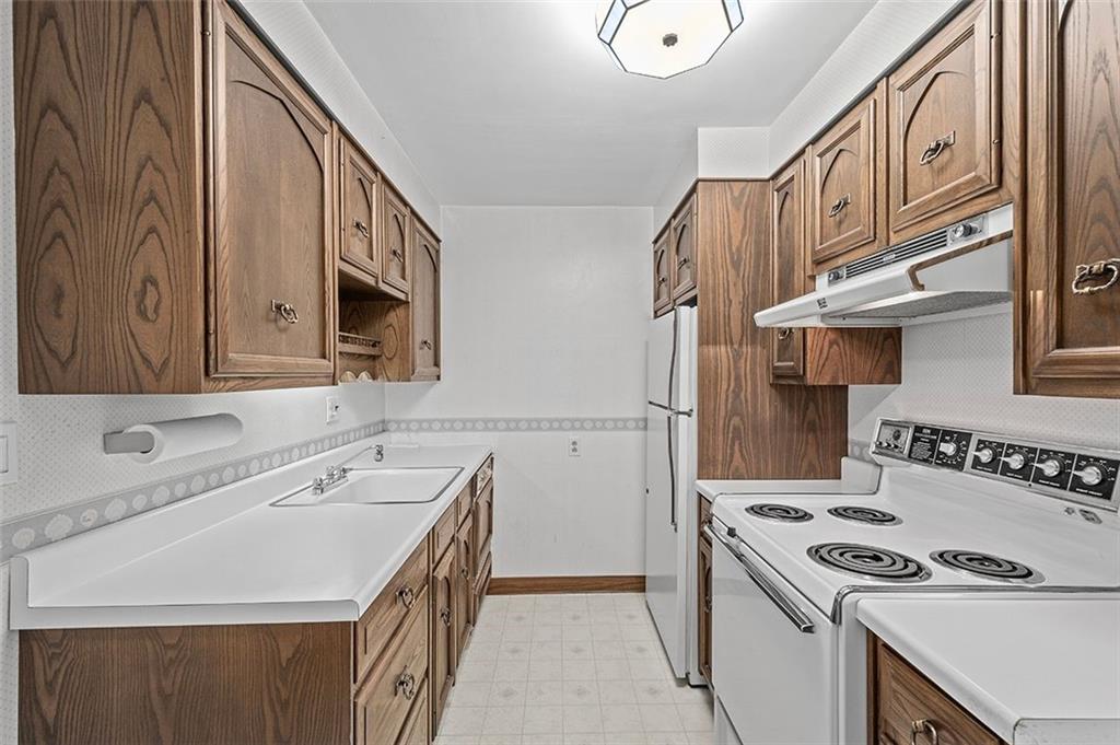 32 Pontiac Road Pittsburgh, PA 15241 - Photo 3 of 23 a kitchen with a sink stove top oven and cabinets