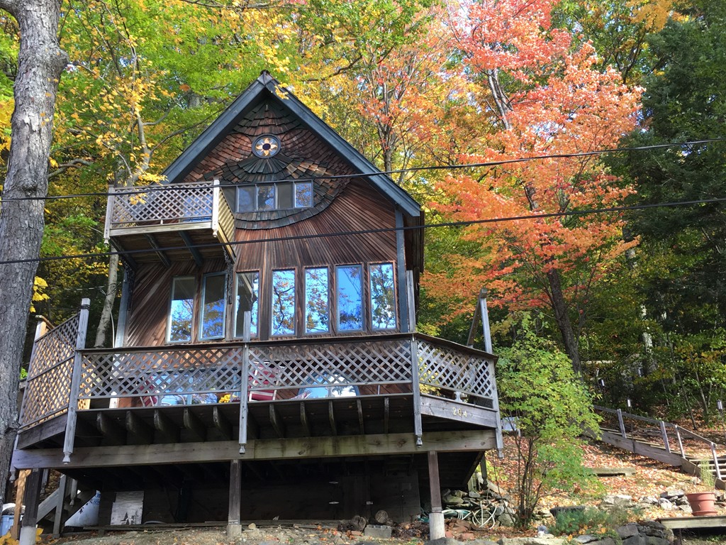 a front view of a house with a small yard