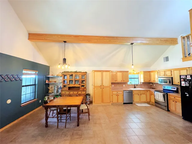 a view of a kitchen with a sink